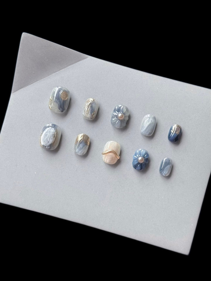 Artistic Press-On Nail Art Set with Unique Floral and Marble Accents