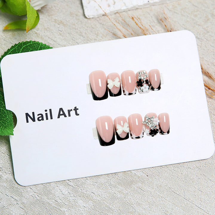 Elegant artificial nails with detailed embellishments Stornfield
