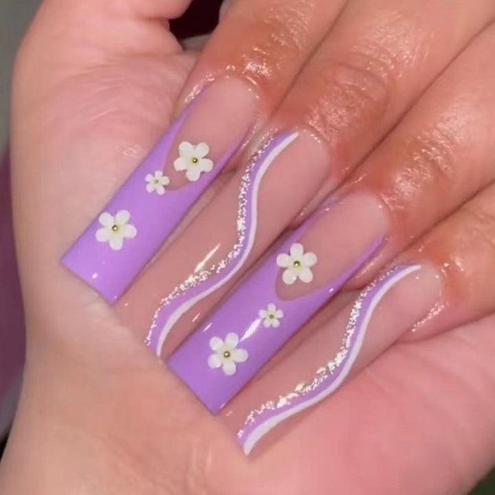 Creative nail art with floral accents Stornfield