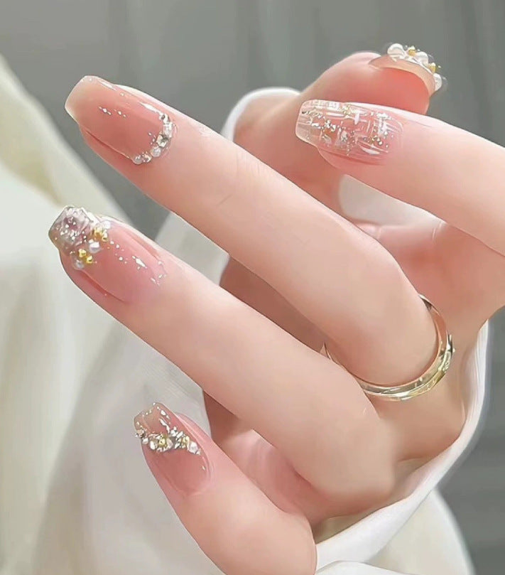Elegant nail design with pearl embellishment Stornfield