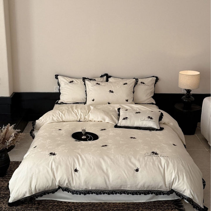 Luxurious cotton satin bedding set with lace border and rose embroidery