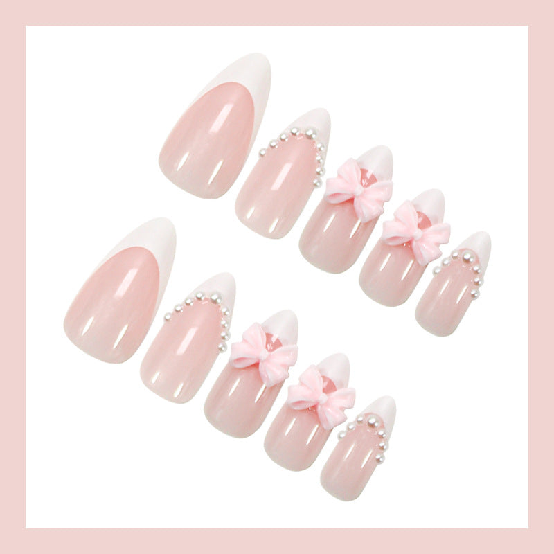 Artificial nail set with elegant bow and pearl decorations Stornfield