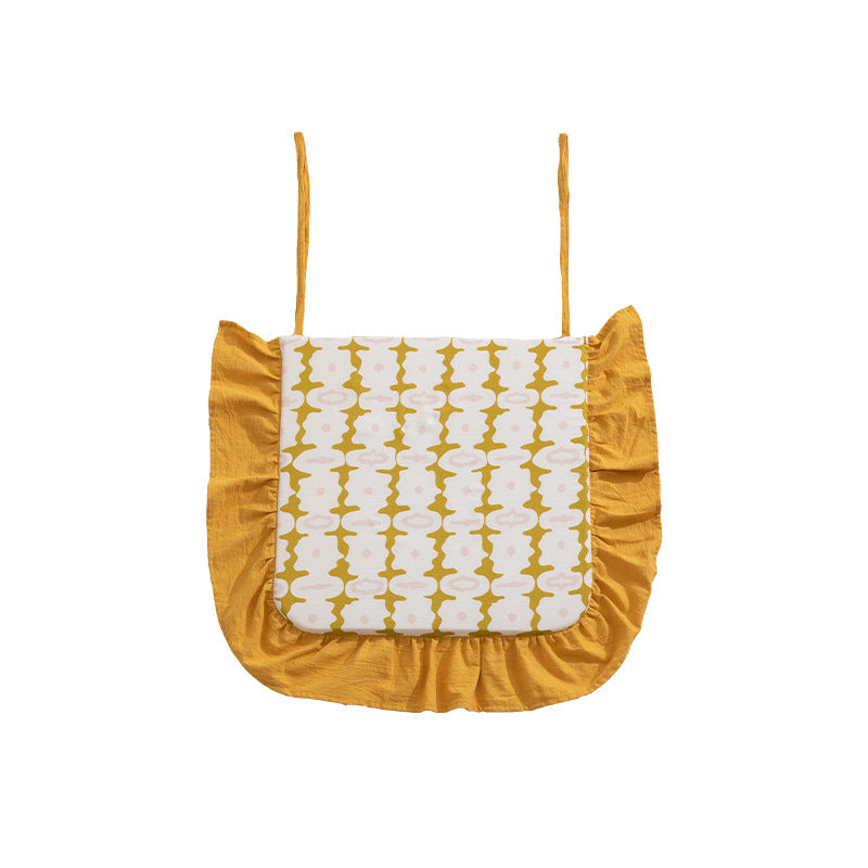 Padded chair seat cushion with tie straps and ruffled edge