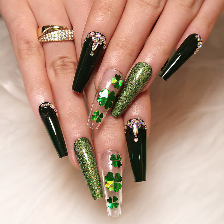 Artificial nail art with clover leaf motifs Stornfield