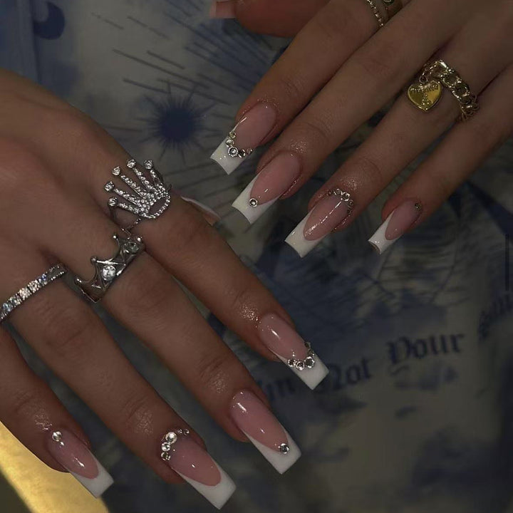 Acrylic nail set with elegant high-gloss finish and luxury rhinestone embellishments Stornfield