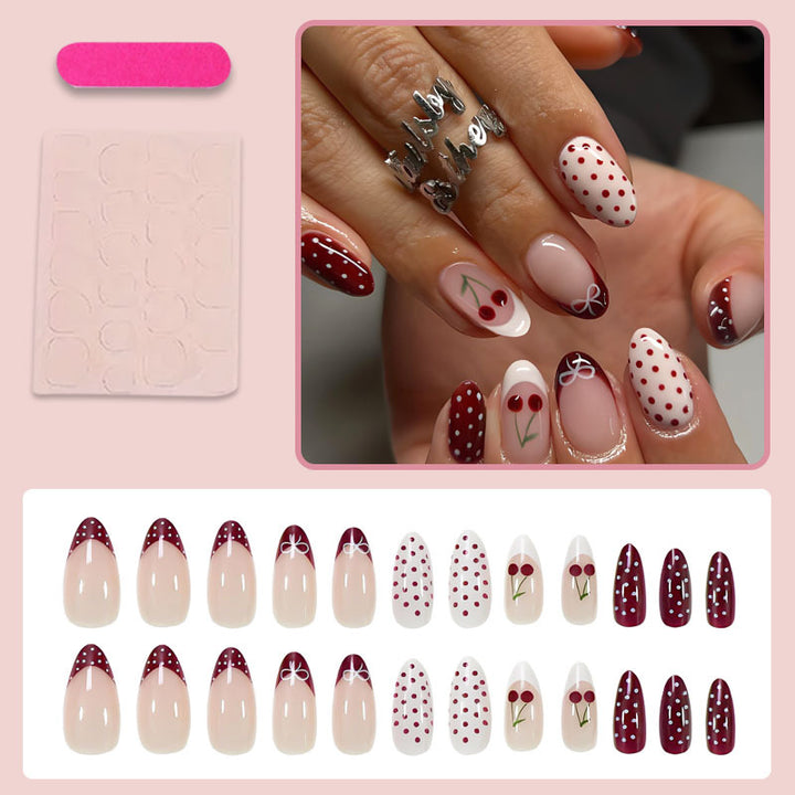 Artificial nail set with elegant cherry and polka dot patterns Stornfield