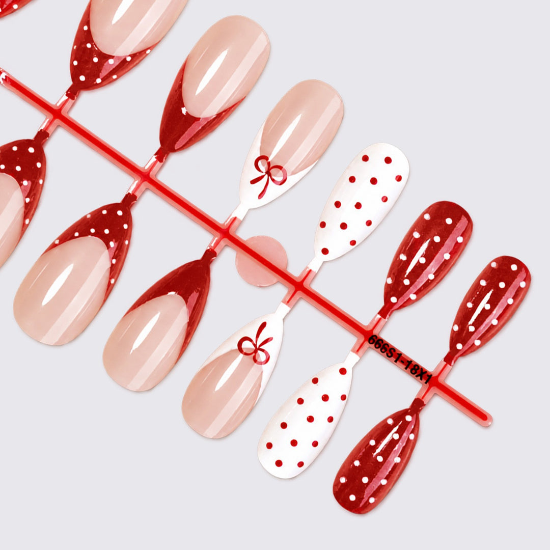 Nail set with elegant bows and polka dots Stornfield