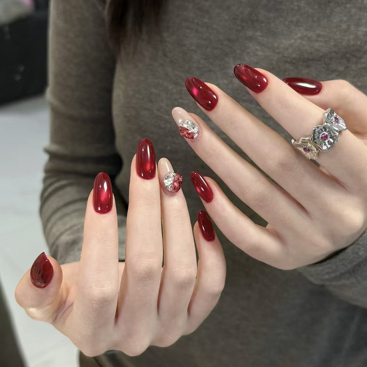 Elegant Press-On Nail Extensions with Decorative Gem Accents