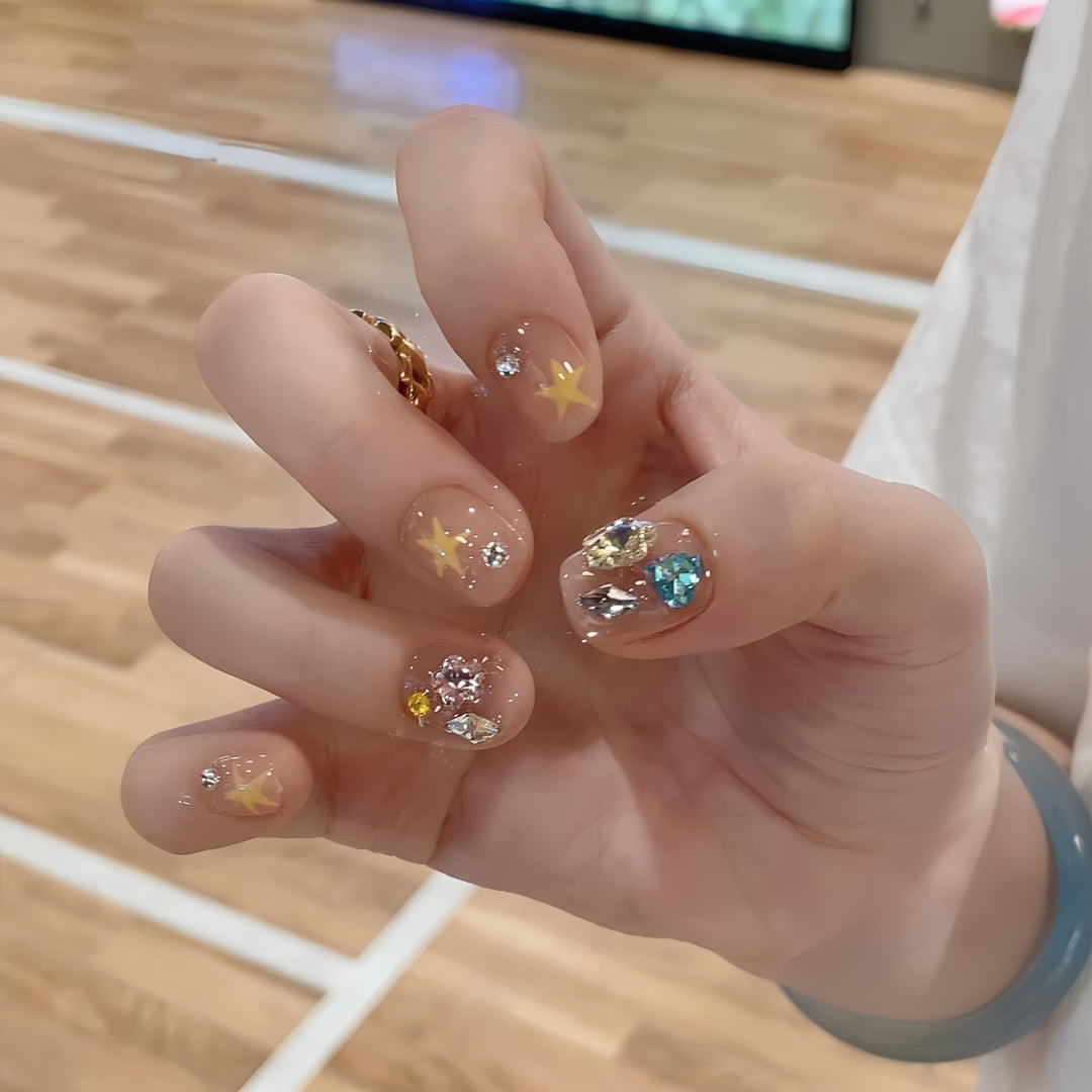 Glittering nail tips with elegant jewelry accents Stornfield