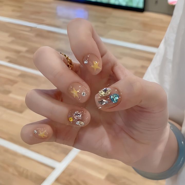 Glittering nail tips with elegant jewelry accents Stornfield