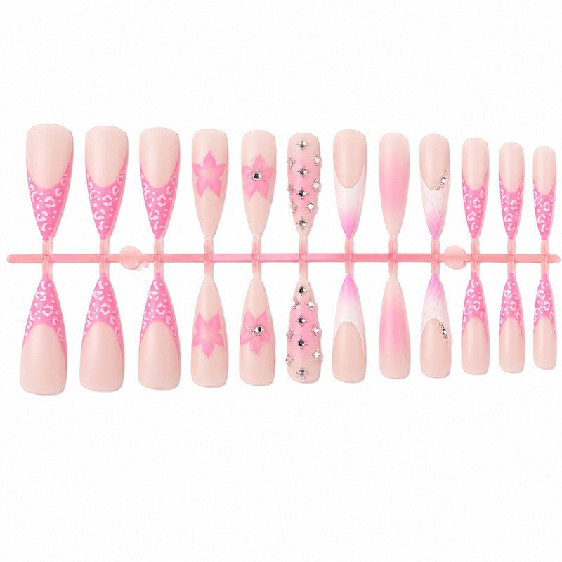 Nail art set with elegant floral embellishments and glamorous accents Stornfield