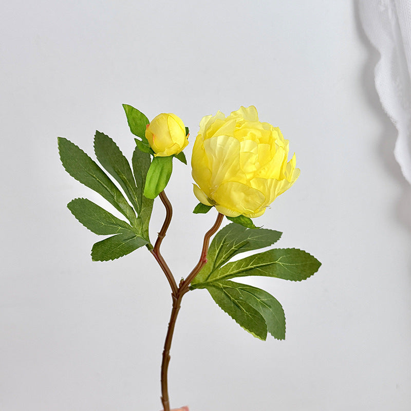 Artificial peony bouquet with delicate flowers and leaves