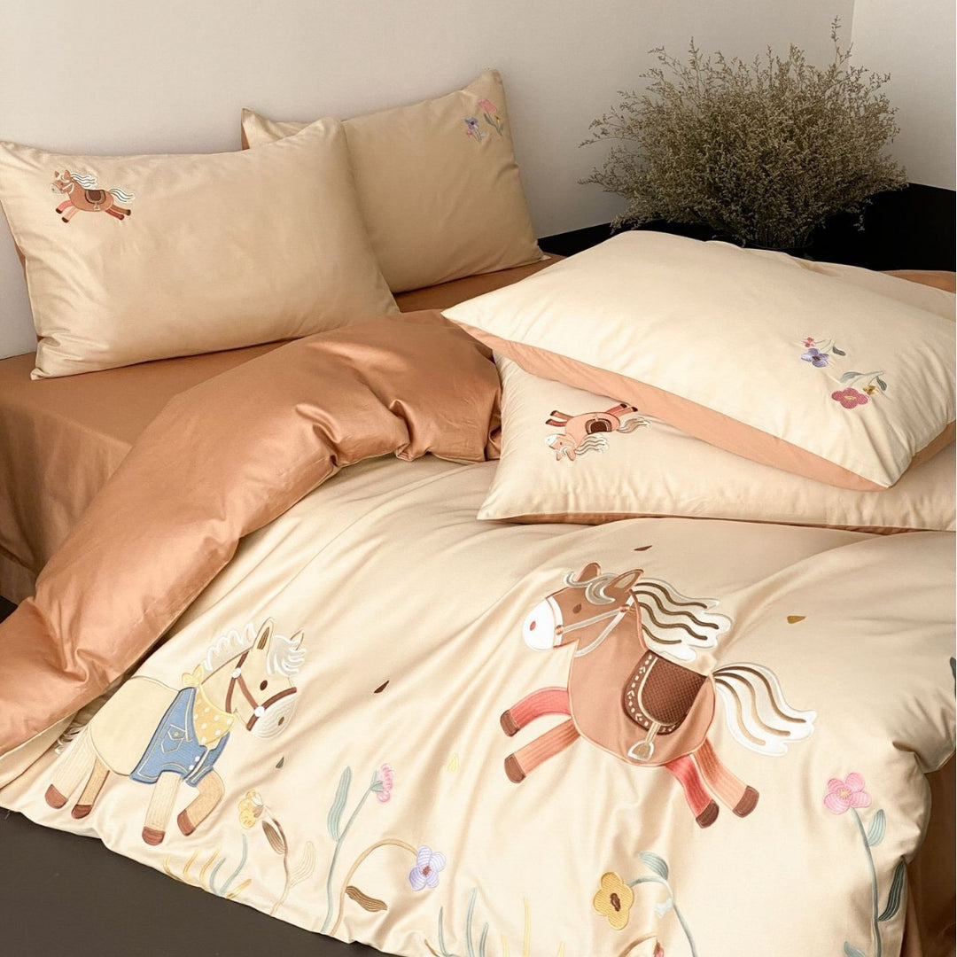 Children's satin bed linen set with embroidered rocking horse applications and velvety texture