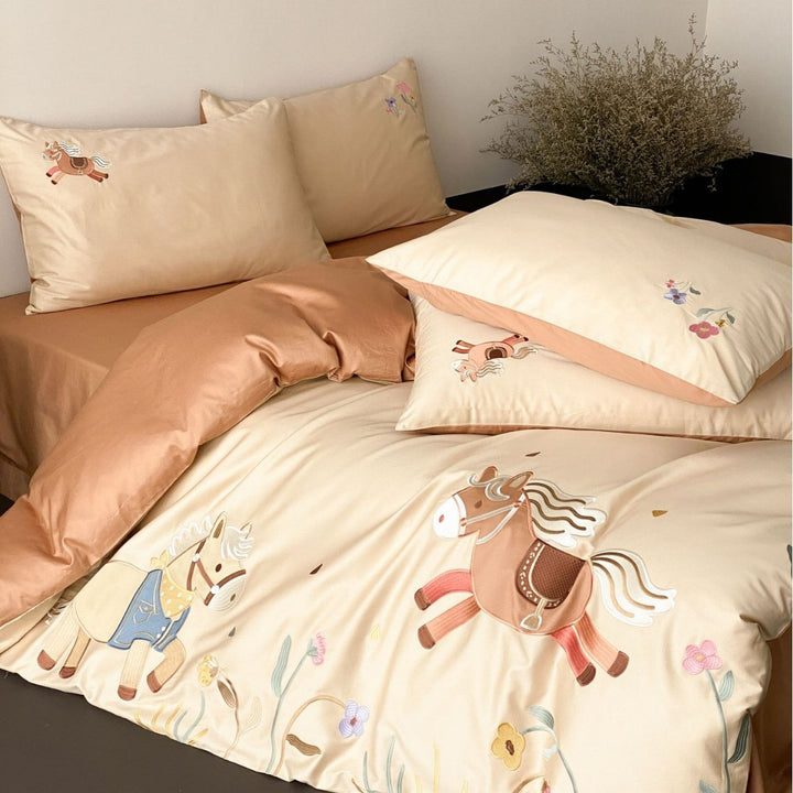 Children's satin bed linen set with embroidered rocking horse applications and velvety texture