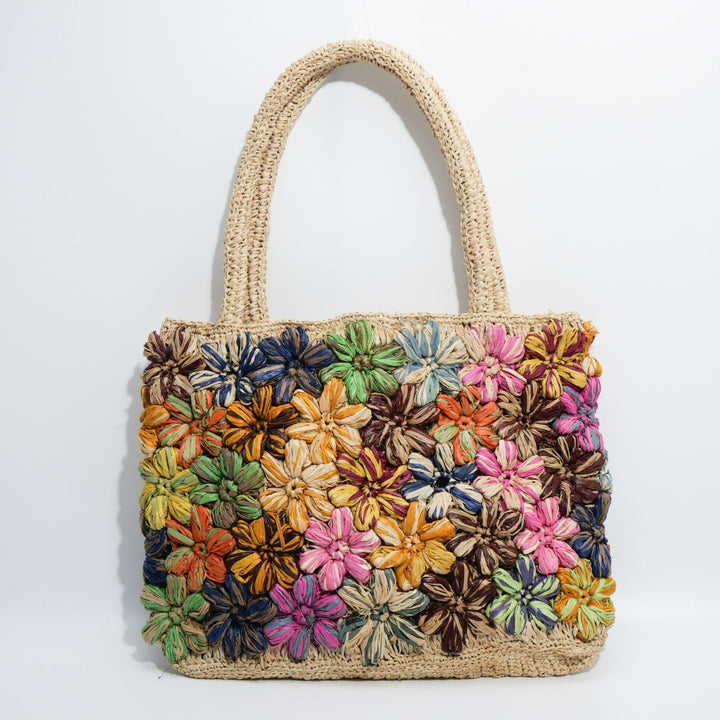 Handcrafted straw bag with floral appliqués Stornfield
