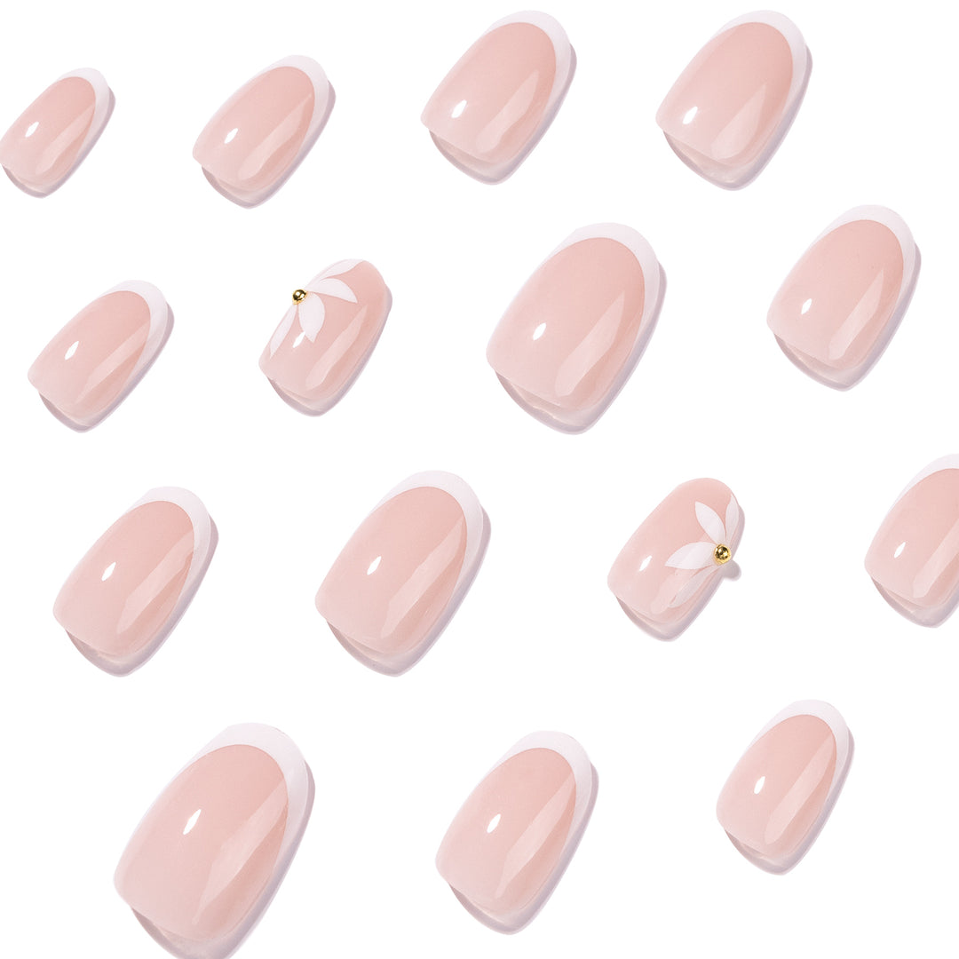 Artful French nails with delicate flowers and glitter accents Stornfield