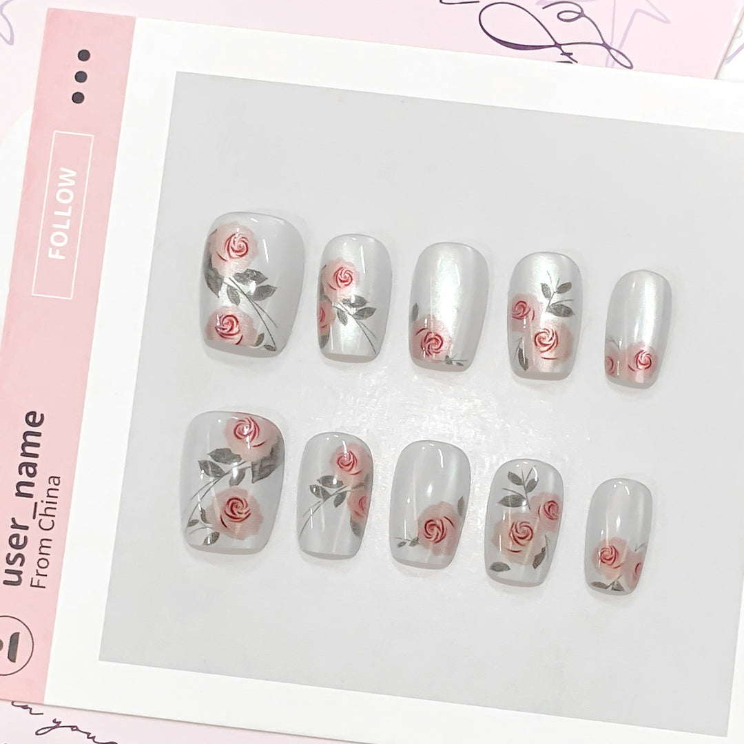 Artful nail extensions with rose designs Stornfield