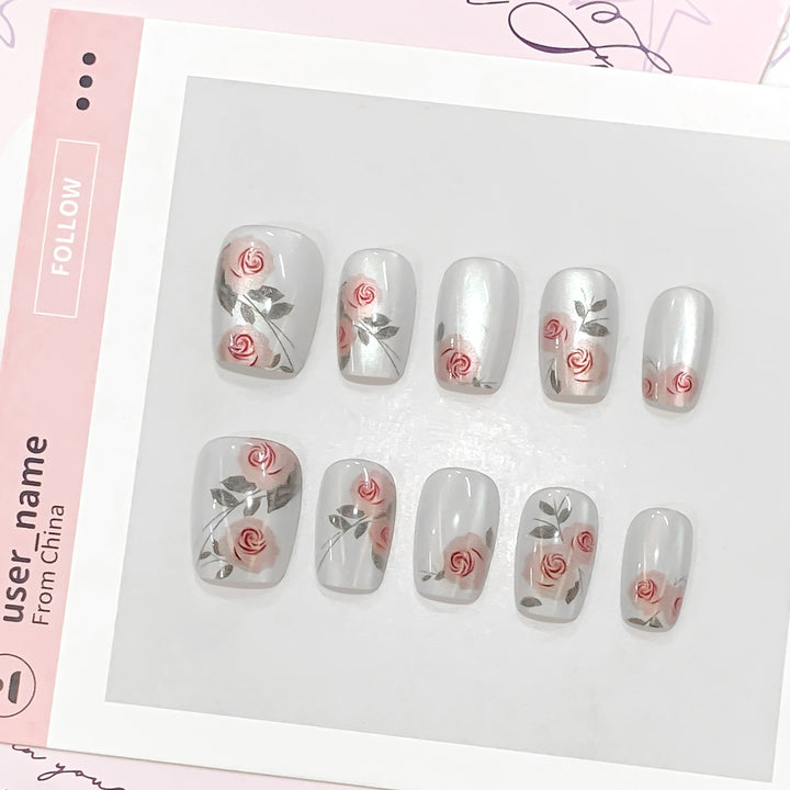 Artful nail extensions with rose designs Stornfield