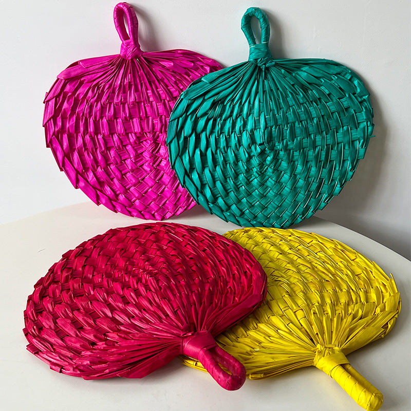 Women hand-woven fan made of natural material Stornfield