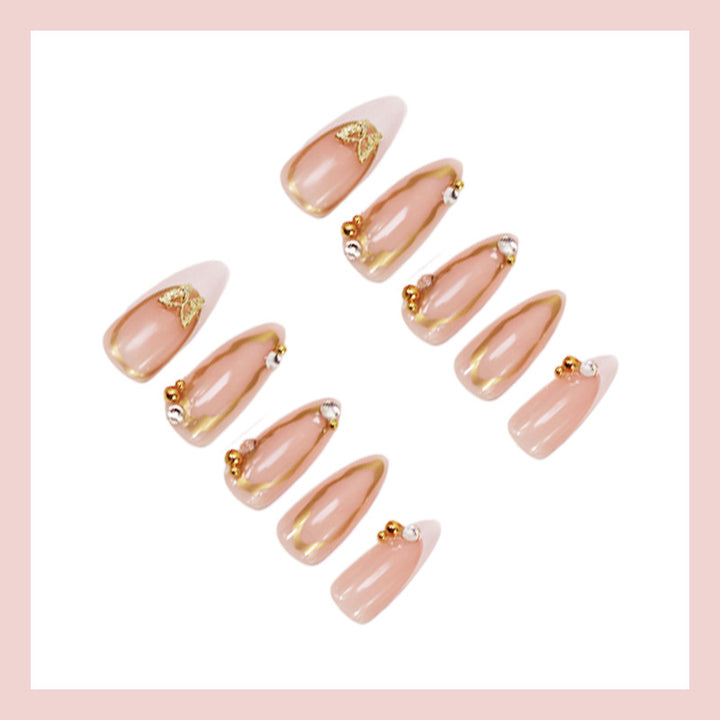 Artificial nail set with elegant gold accents and luxurious decorations Stornfield