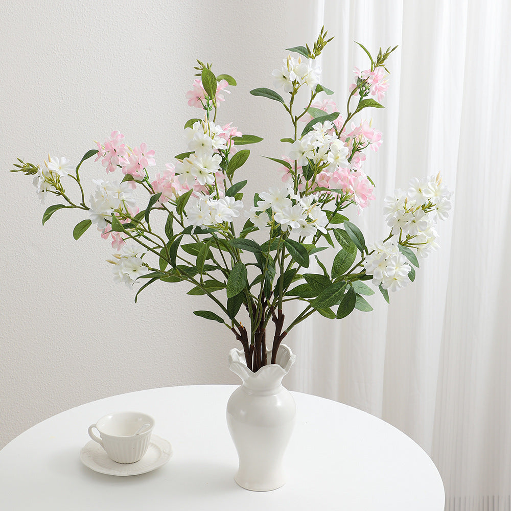 Decorative art branch with white flowers