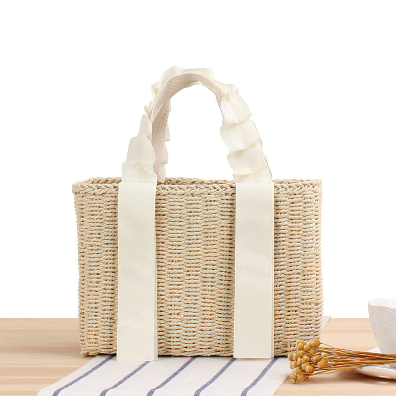 Playful basket bag with elegant fabric handle Stornfield