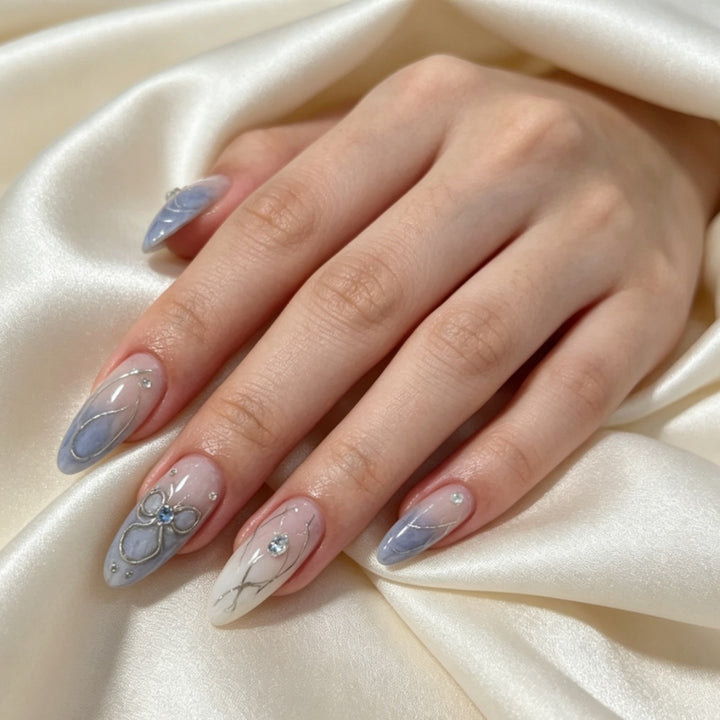 Artistic Press-On Nail Design with Floral and Gem Accents Stornfield