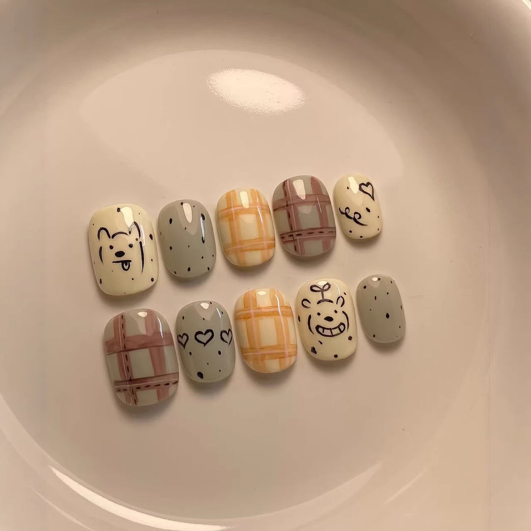 Playful Cartoon-Character Press-On Nail Art Collection