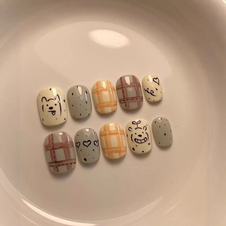 Playful Cartoon-Character Press-On Nail Art Collection
