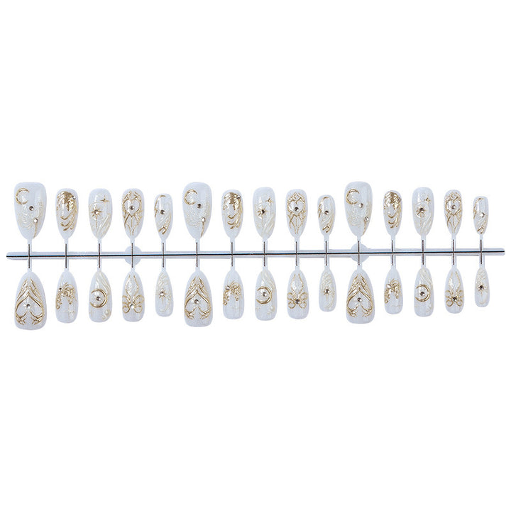 Acrylic nail set with elegant embellishments and glitter accents Stornfield