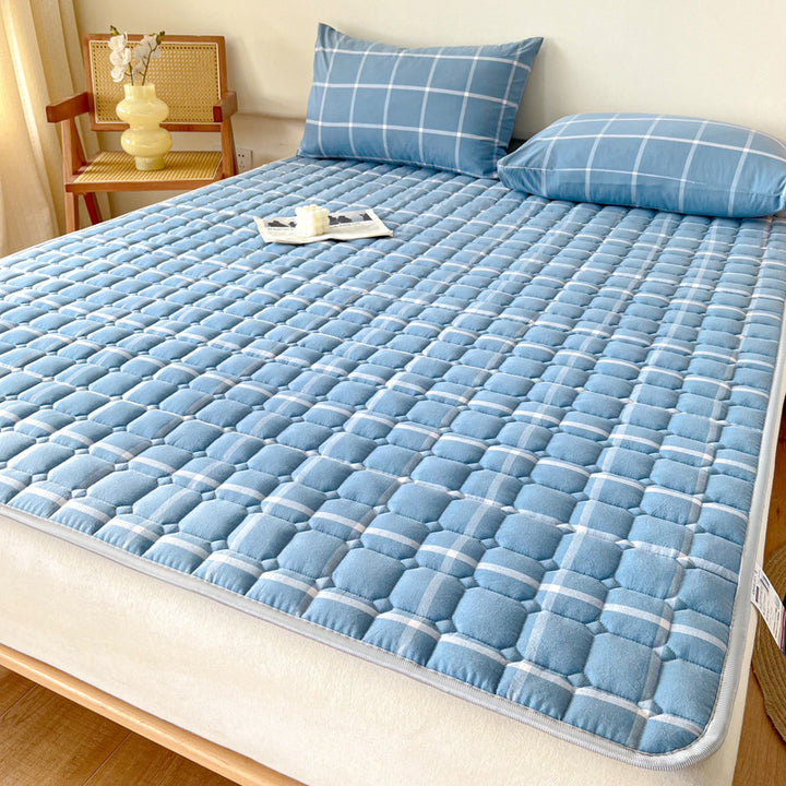 Padded mattress protector-topper with quilting and non-slip underside