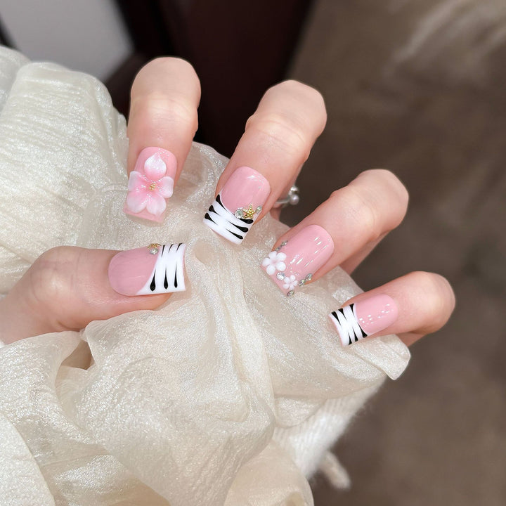 Artistic Press-On Nail Enhancements with Pattern and Gem Accents