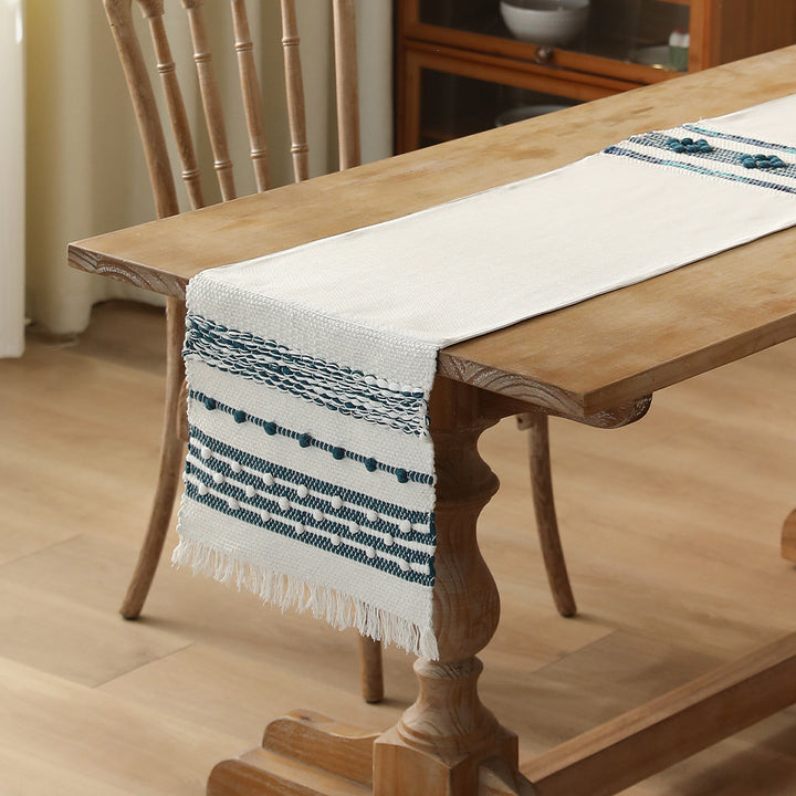 Woven cotton table runner with fringes and textured pattern Stornfield
