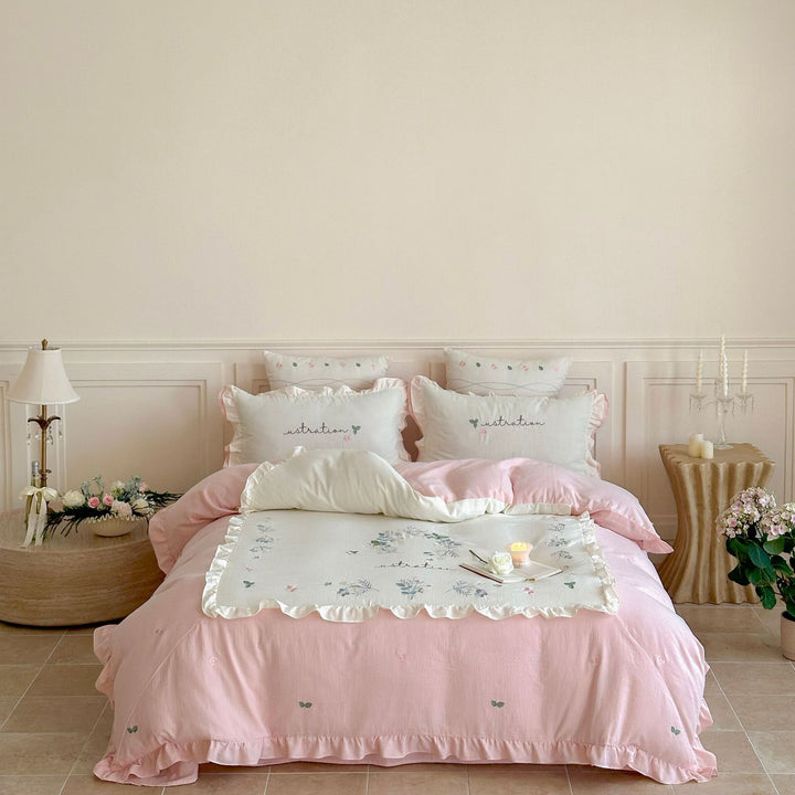 Cotton bedding set in country house style with ruffle edge and fine floral embroidery Stornfield