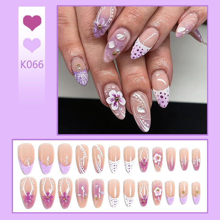 Artificial nail set with exotic floral and glitter accents Stornfield