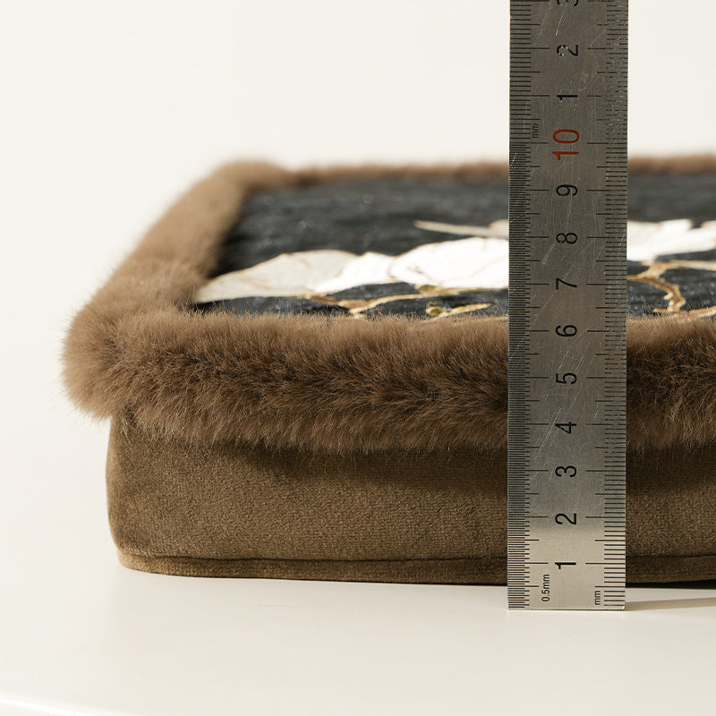Padded seat cushion with velvet cover, floral embroidery and faux fur trim Stornfield