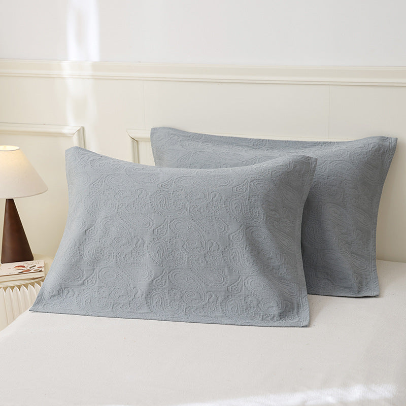 Quilted pillowcase set with paisley relief texture made from breathable cotton blend
