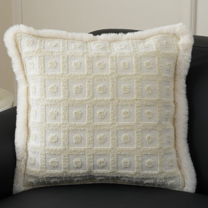 Square decorative pillow with embossed circular relief and soft faux fur edging