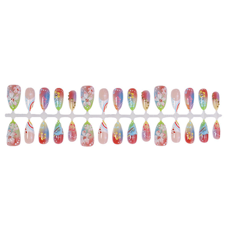 Artificial nail set with various designs and shiny embellishments Stornfield