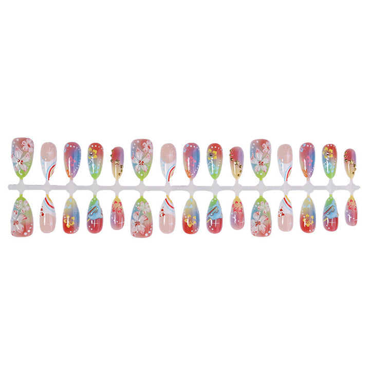 Artificial nail set with various designs and shiny embellishments Stornfield