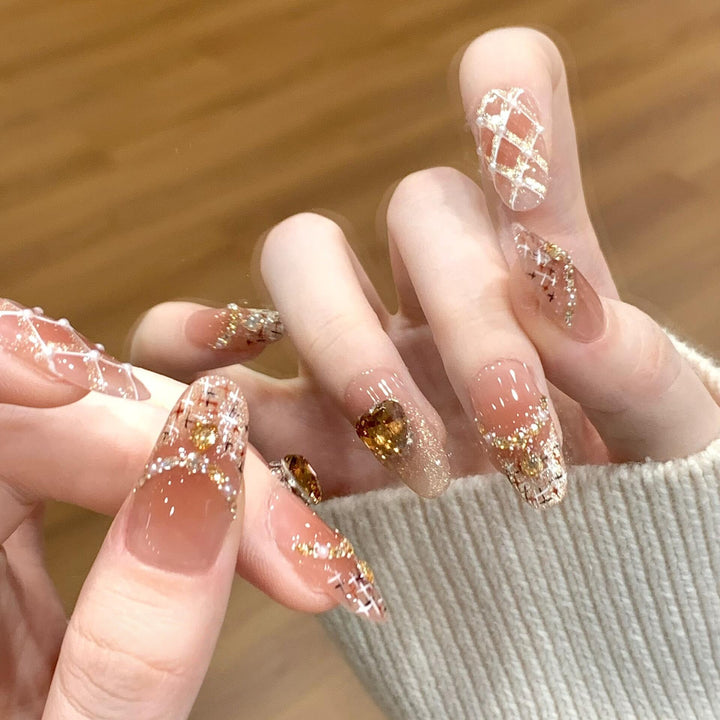 Glamorous artificial nails with glitter and heart design Stornfield