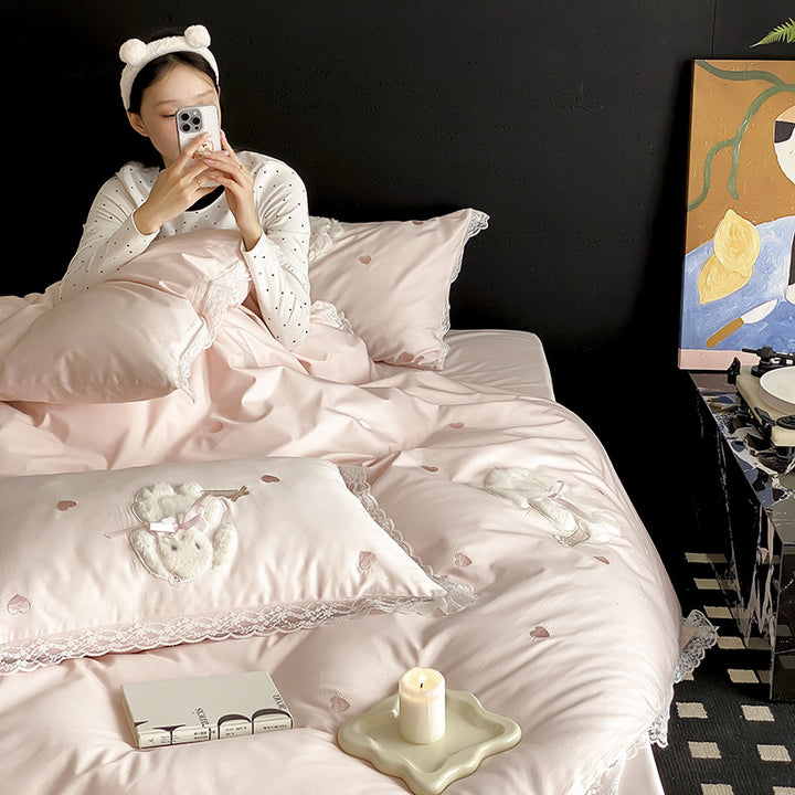 Luxurious satin bedding set with plush bunny appliqué and lace trim