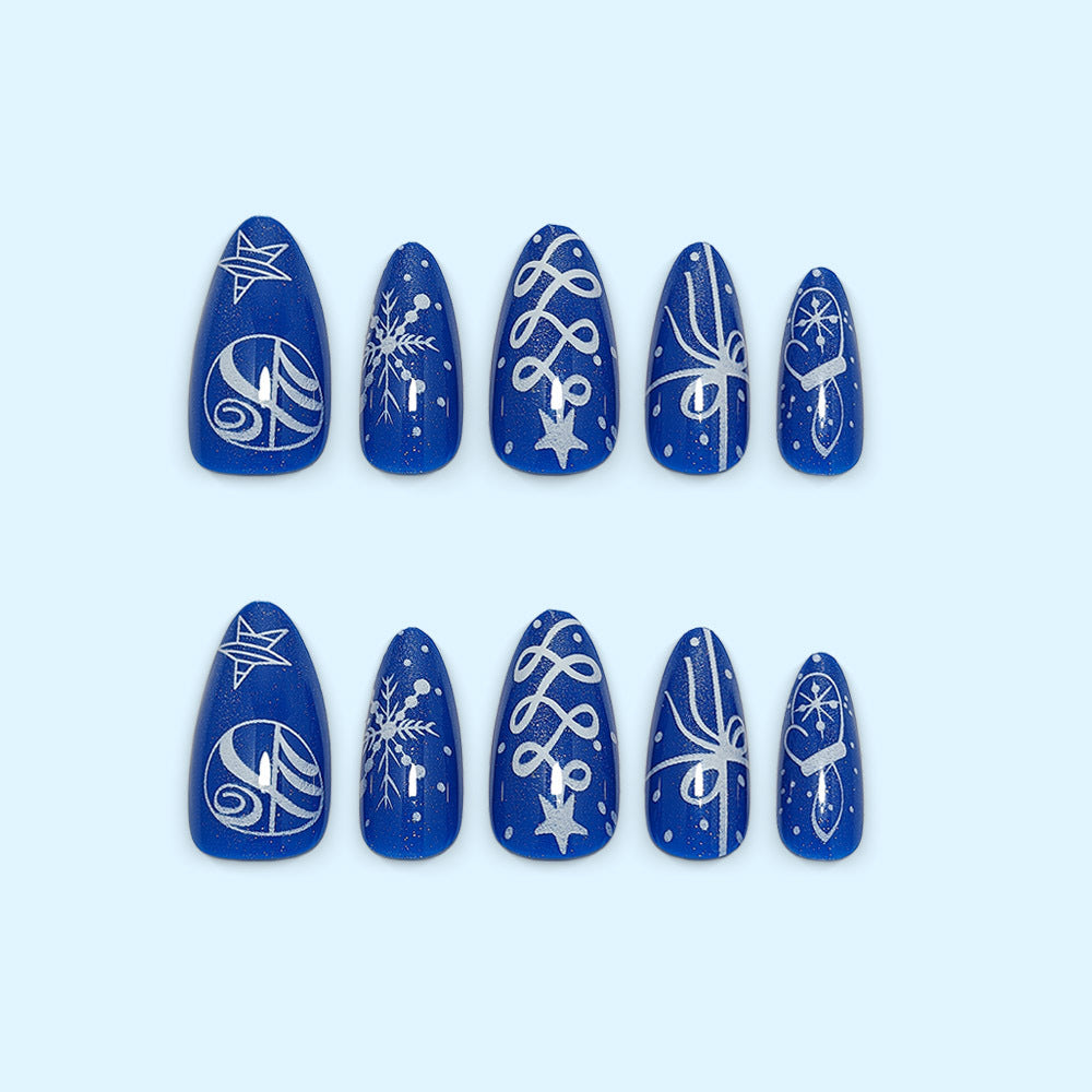 Artificial nails in festive winter design with glittering snowflakes and elegant decorations Stornfield