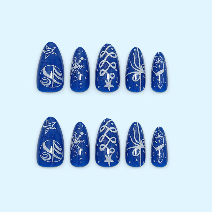 Artificial nails in festive winter design with glittering snowflakes and elegant decorations Stornfield