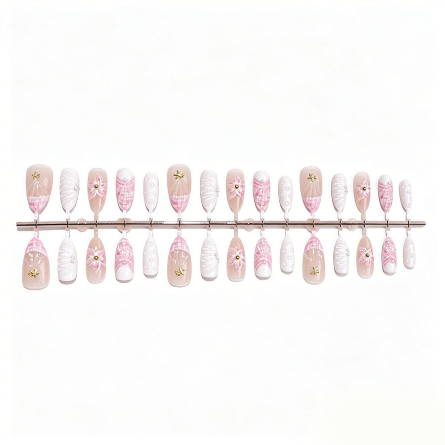 Art nail set with elegant floral decorations and glitter accents Stornfield
