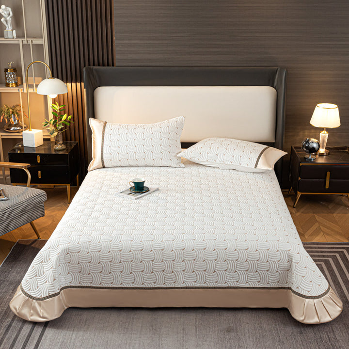 Quilted bedspread set with satin ruffle and geometric wave relief