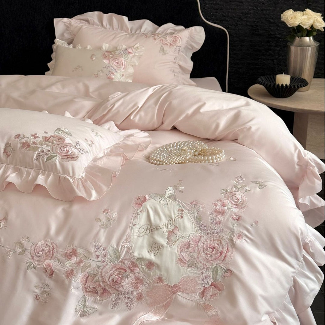 Romantic satin bed linen set with richly embroidered rose border and frill