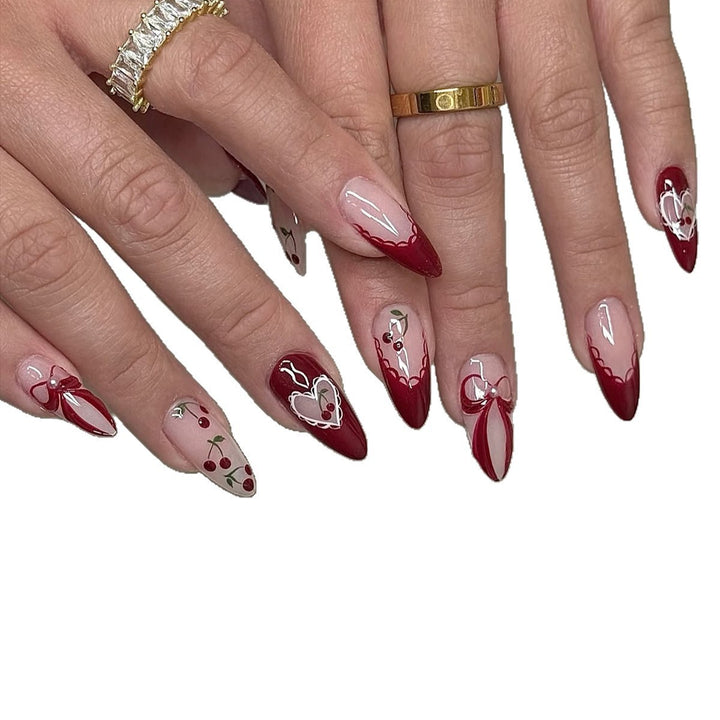 Creative nail set with romantic heart and bow accents Stornfield