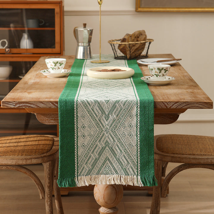 Woven table runner with geometric ethnic ornament and fringes Stornfield