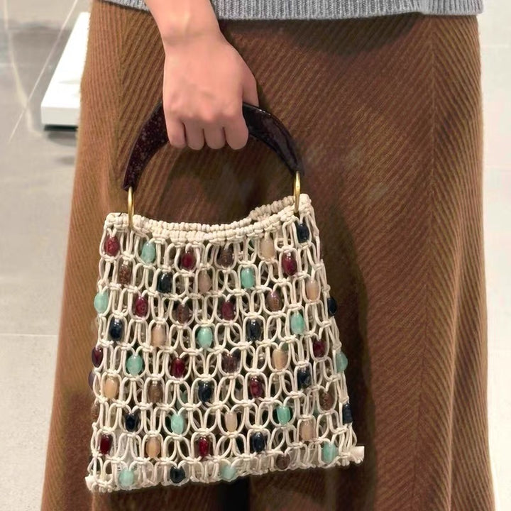 Handcrafted designer shoulder bag with unique stone accents Stornfield